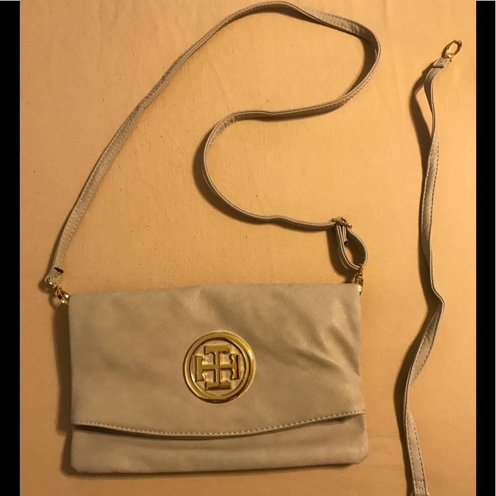 Tan purse. Gold accents. Two straps. NWOT.